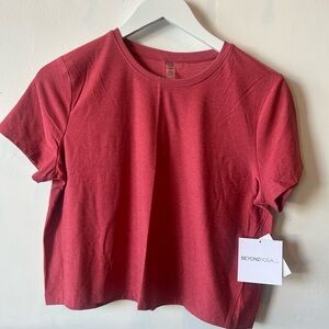 Beyond Yoga Women's Short Sleeve cropped Tee in salmon pink